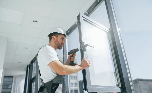 using-drill-repairman-is-working-indoors-modern-room